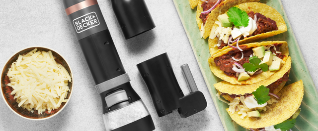 Grey, BLACK+DECKER kitchen wand with spice grinder, can opener and bottle opener attachments next to chili con carne tacos