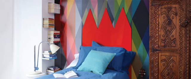 Red headboard and neatly made bed