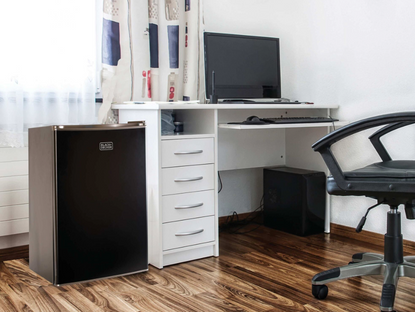 BLACK+DECKER mini fridge in a dorm room