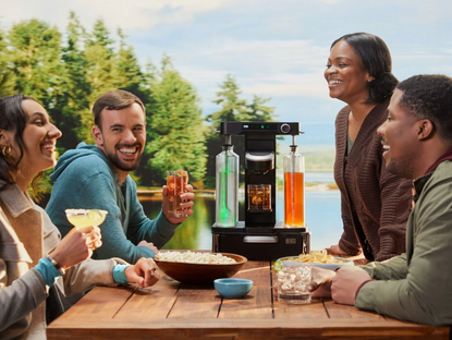 People enjoying cocktails lakeside