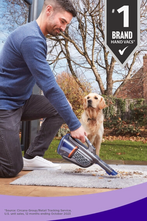 man using dustbuster hand vac