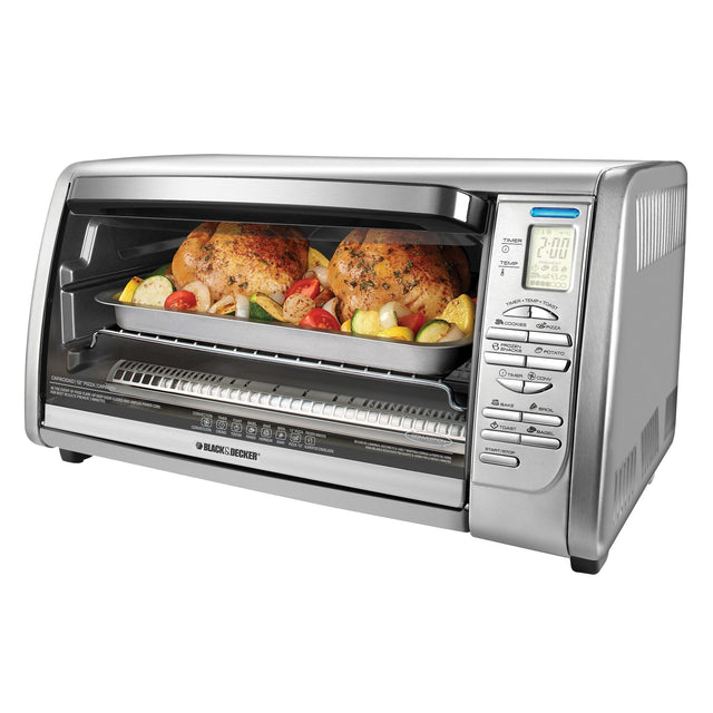 Countertop Convection Toaster Oven with chicken and vegetables in oven on white background