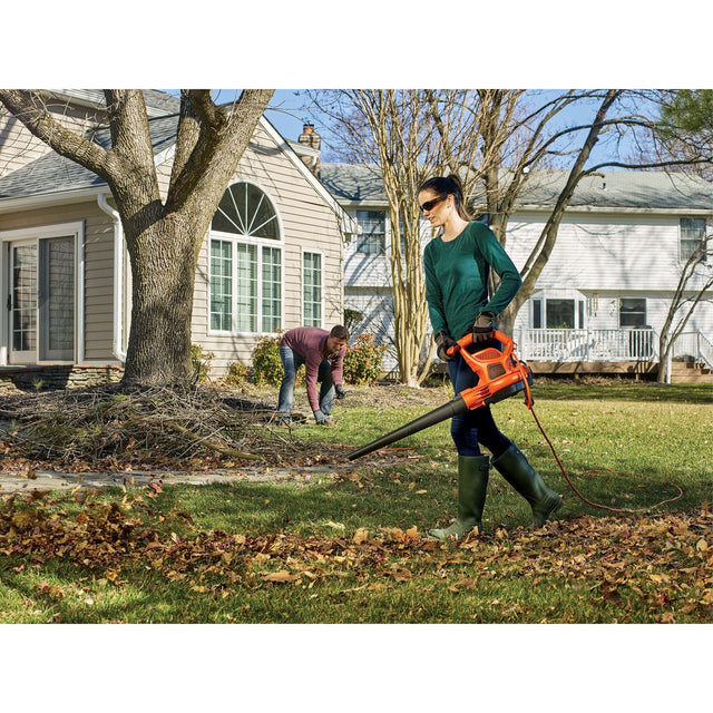Woman using BLACK+DECKER leaf blower