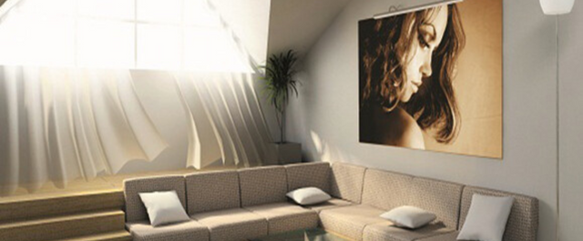 Large living room with a picture hung above a sectional couch