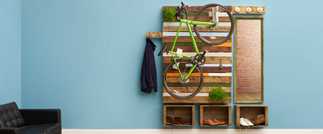 Bike rack and shelves made of pallets hanging on wall