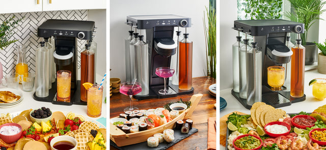 bev by Black and Decker cocktail maker set up with drinks and assorted food around it