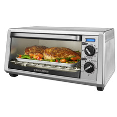 Countertop Toaster Oven with chicken and vegetables cooking inside.